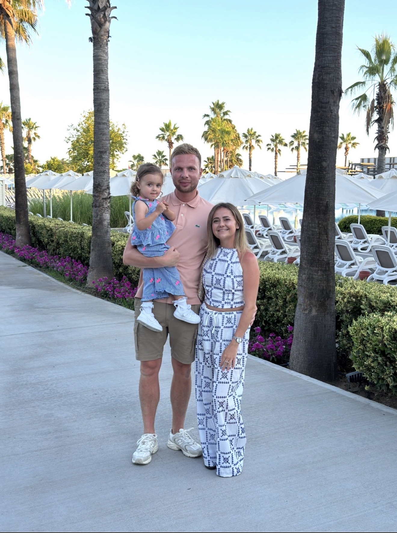 Layla's family by the palm trees